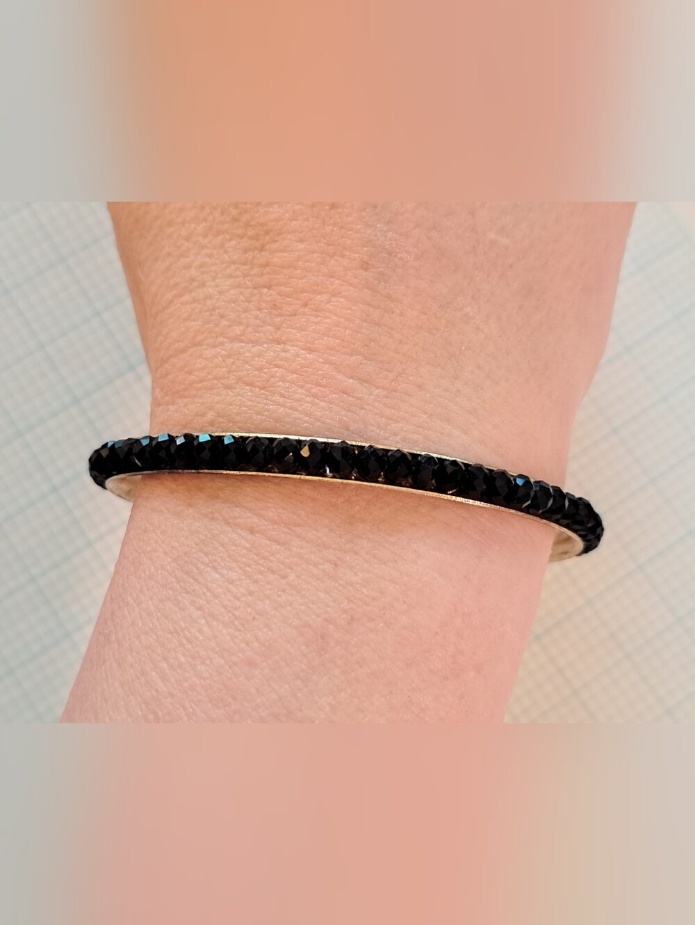 Gold-Tone Eternity Bangle Bracelet with Black Crystal Row
